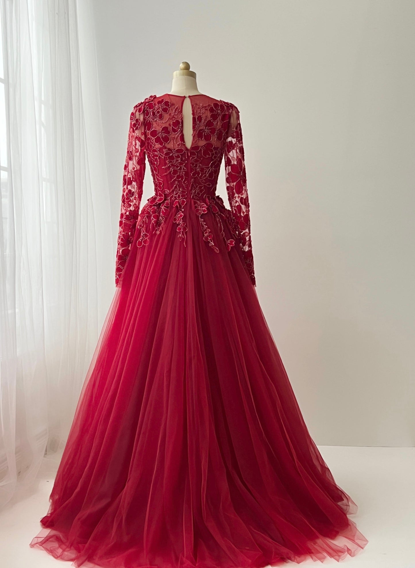 Red A-Line gown with long sleeves, lace and embroidery