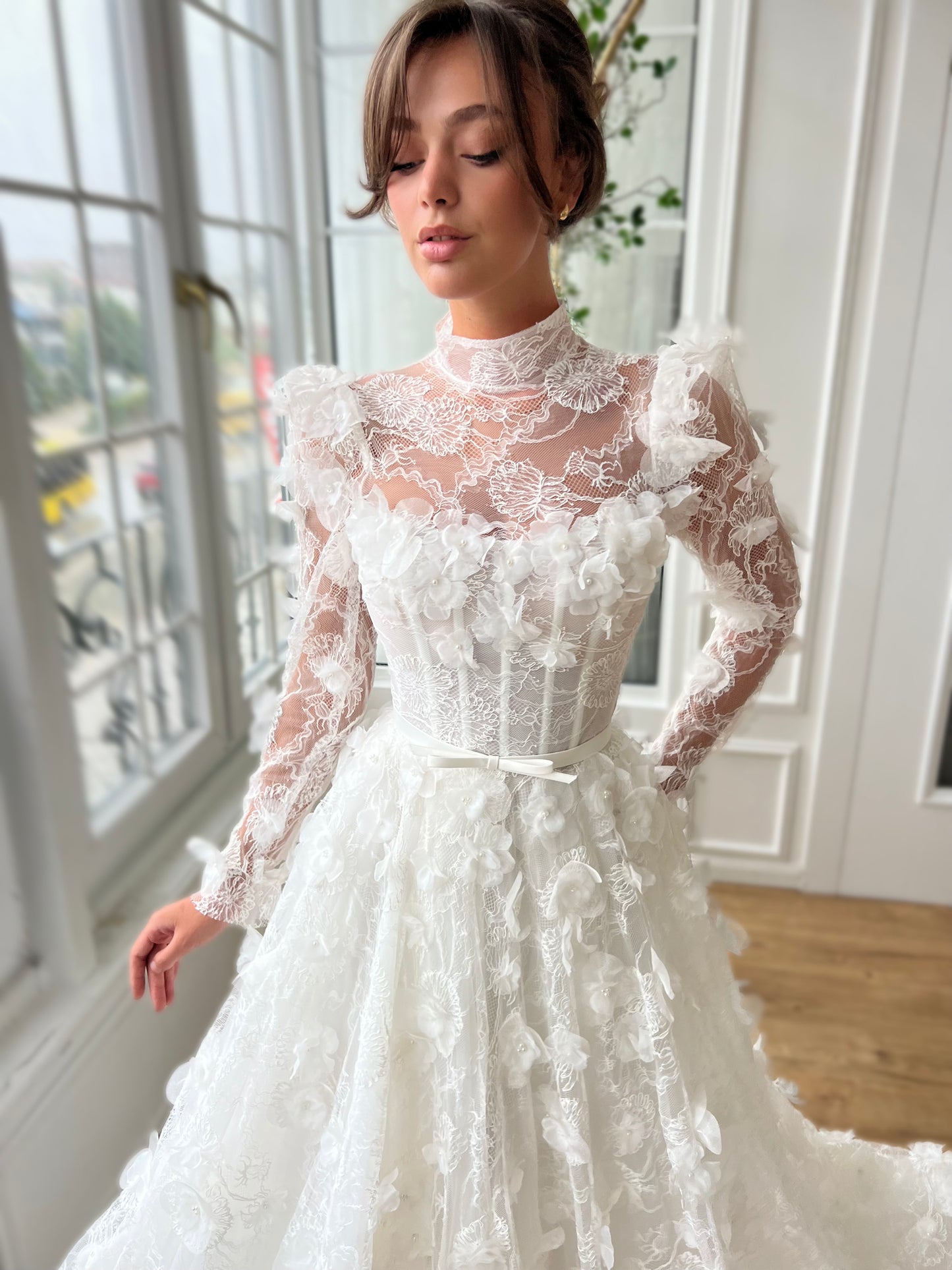 White bridal A-Line gown with long sleeves and embroidery