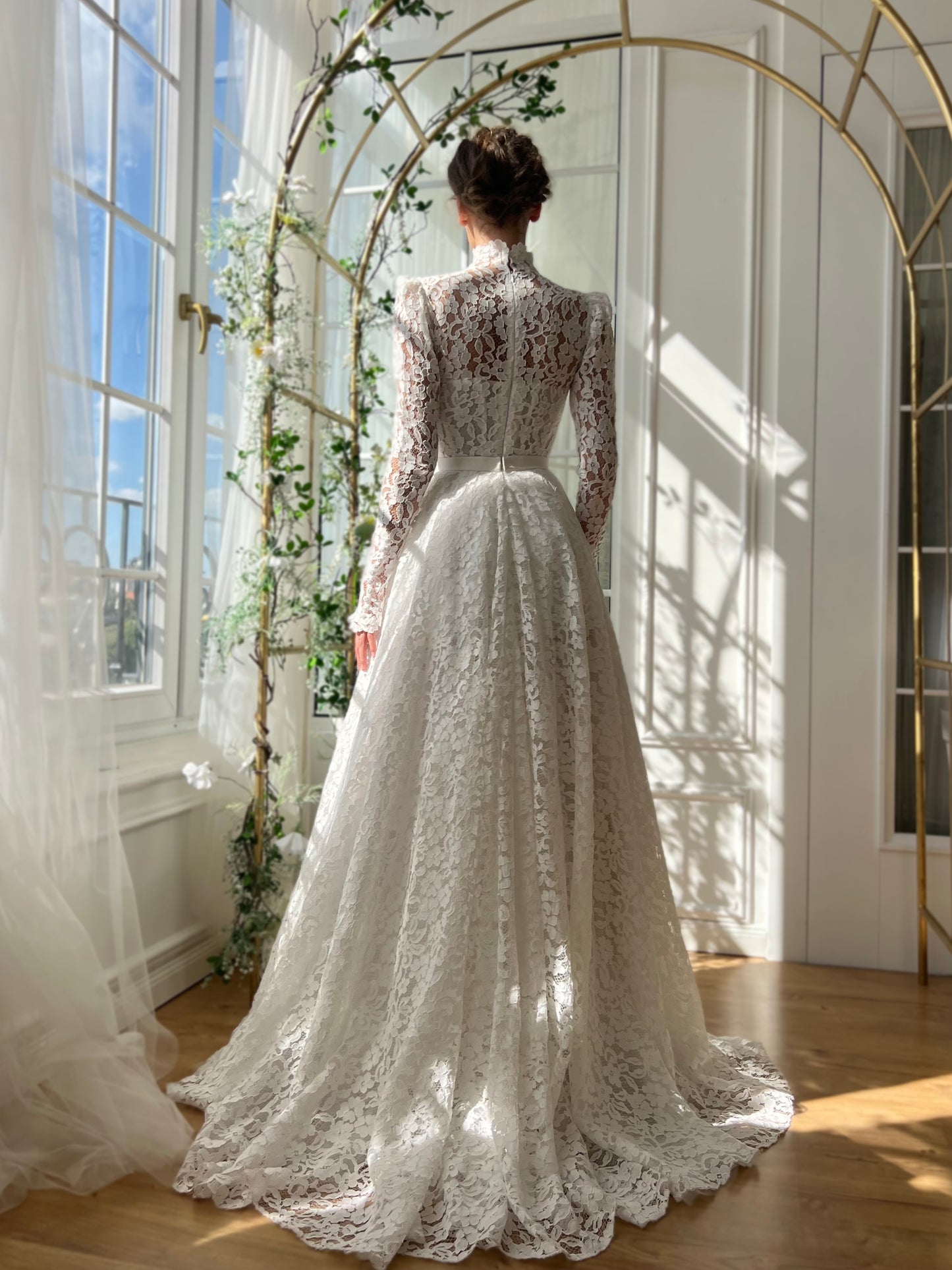 White bridal A-Line gown with long sleeves and embroidery