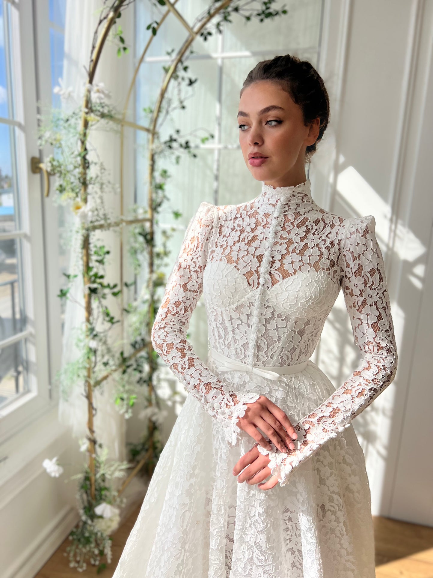 White bridal A-Line gown with long sleeves and embroidery