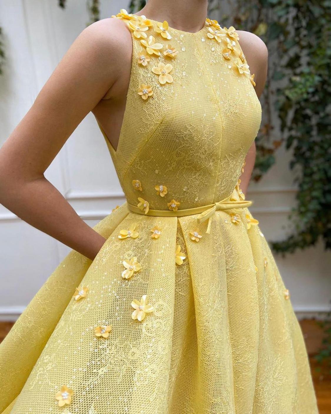 Yellow A-Line dress with no sleeves and embroidery