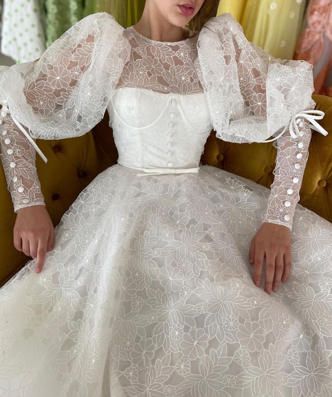 A Line white bridal dress with buttons, flowers and long sleeves