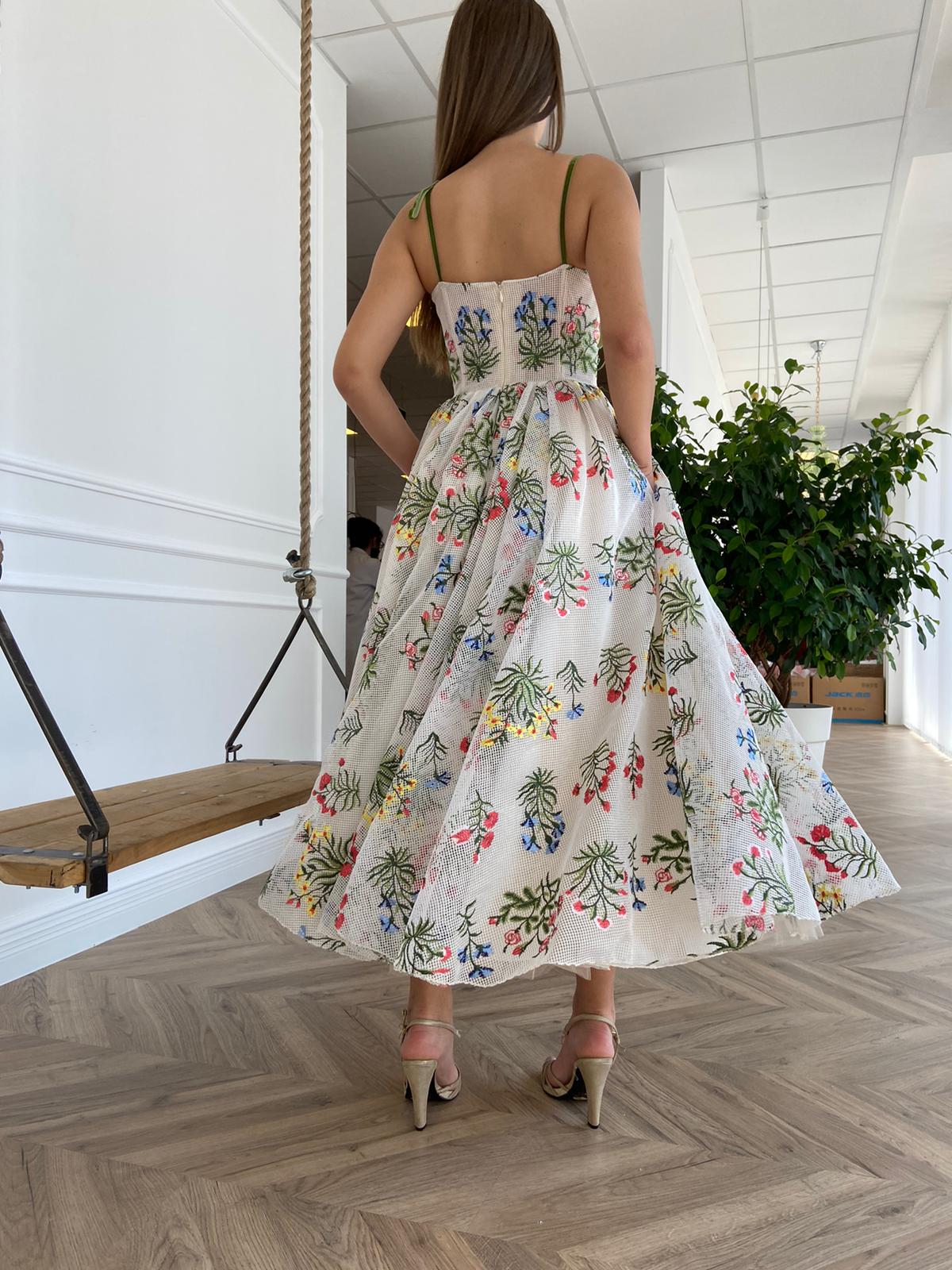 White midi dress with spaghetti straps and embroidery