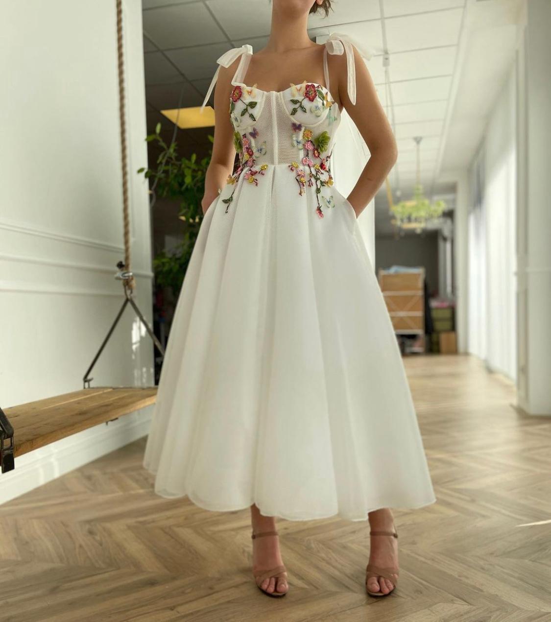 Midi white bridal dress with embroidered flowers and spaghetti straps