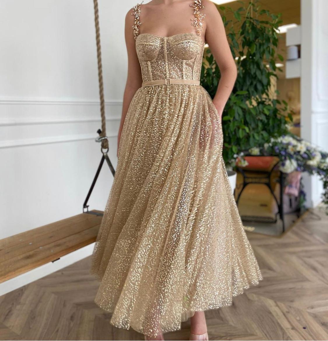 Gold midi dress with spaghetti straps, embroidery and belt