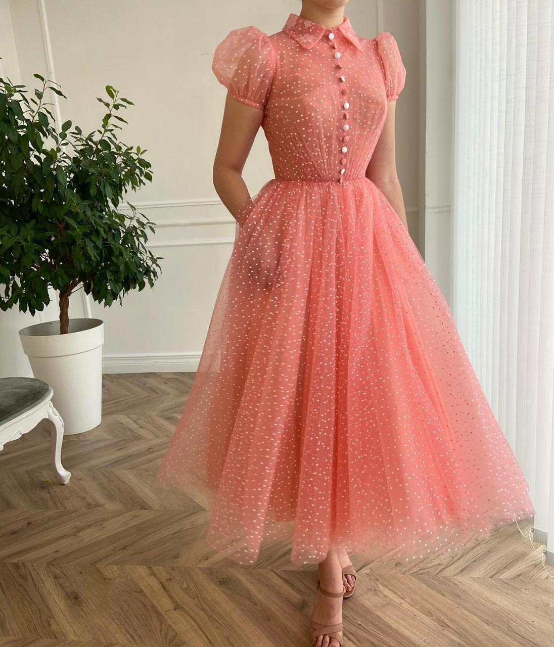 Pink midi dress with short cap sleeves and dotted fabric