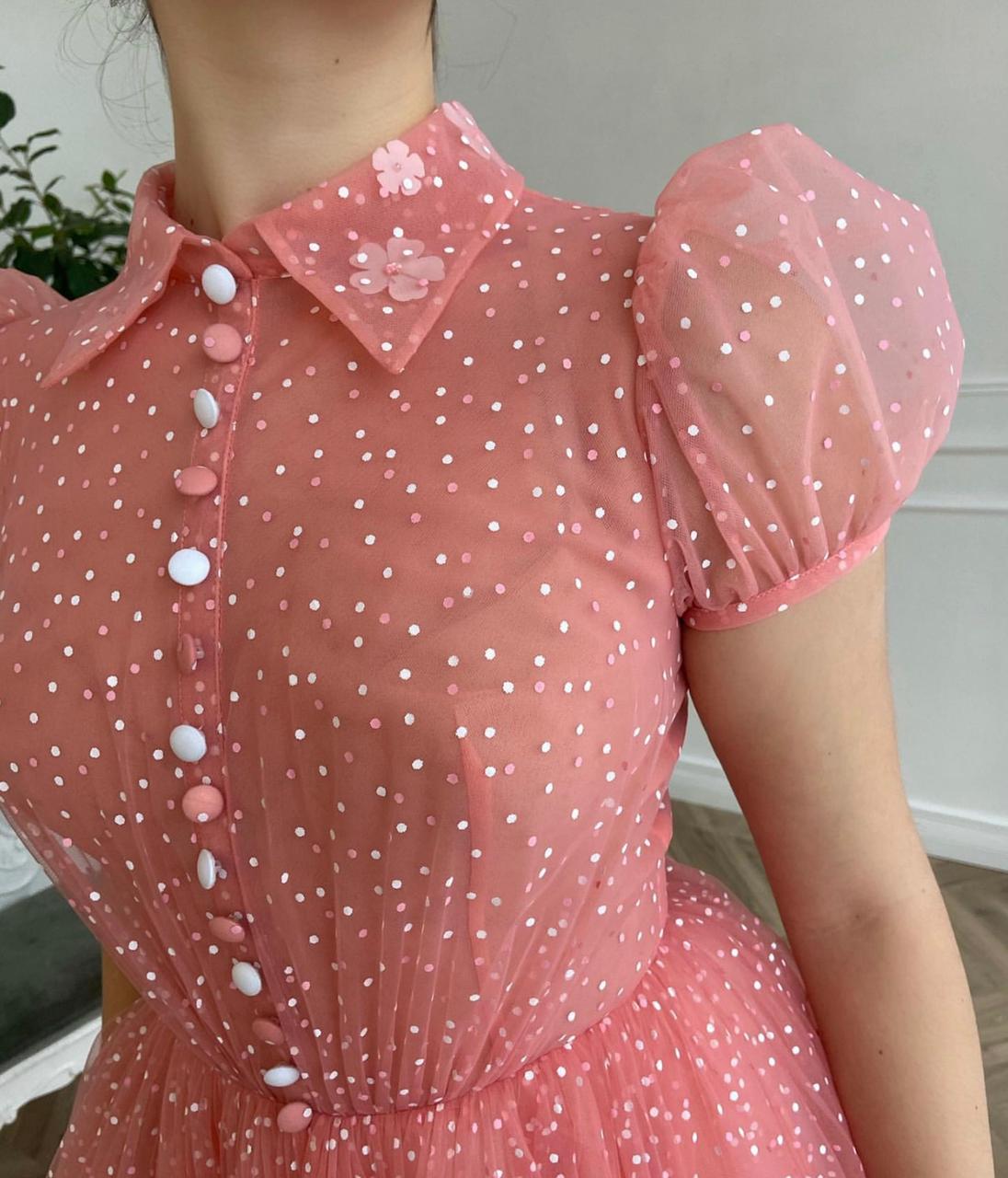 Pink midi dress with short cap sleeves and dotted fabric