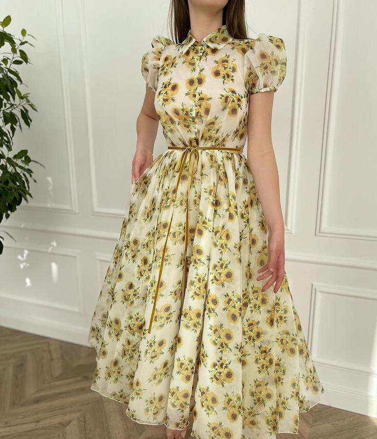 White midi dress with short sleeves and printed flowers