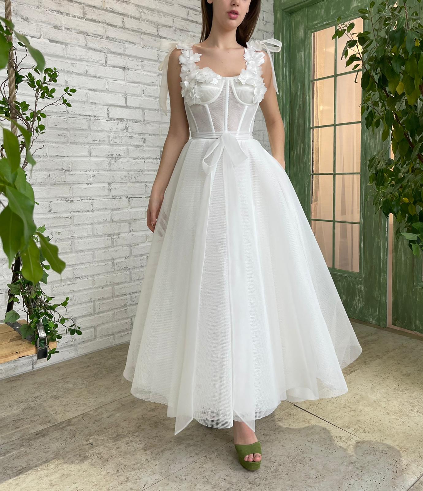 White bridal midi dress with straps, flowers and embroidery