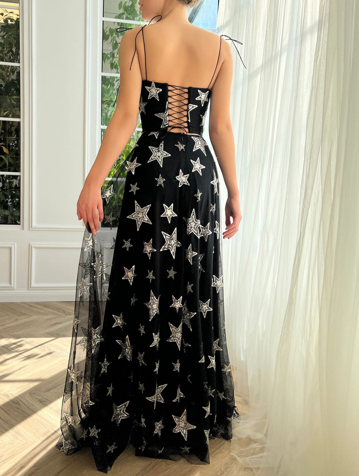 Black two piece dress with spaghetti straps and starry fabric