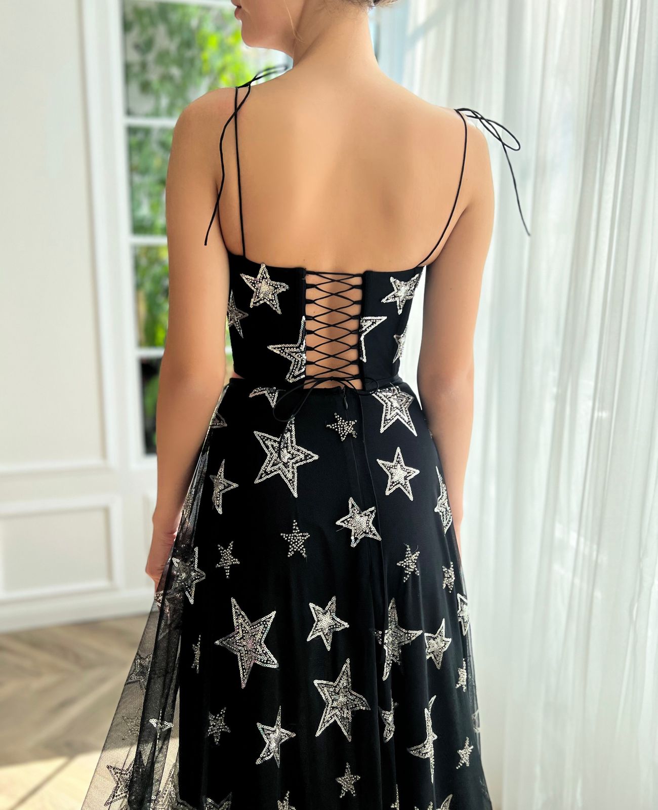 Black two piece dress with spaghetti straps and starry fabric