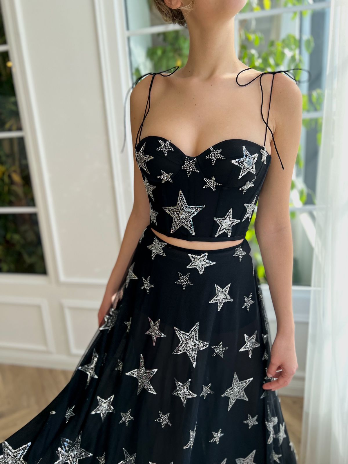 Black two piece dress with spaghetti straps and starry fabric