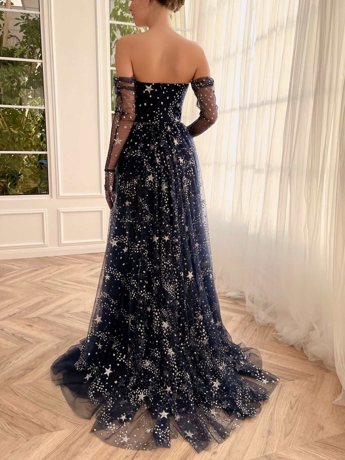 Blue A-Line dress with no sleeves, gloves and starry fabric