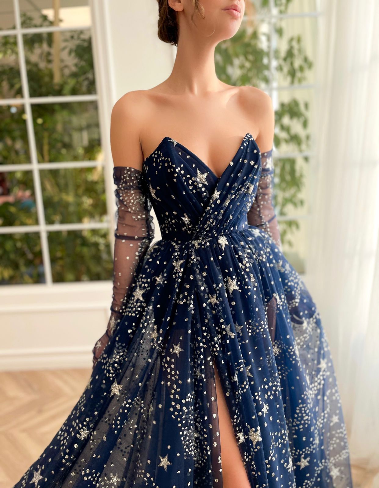 Blue A-Line dress with no sleeves, gloves and starry fabric