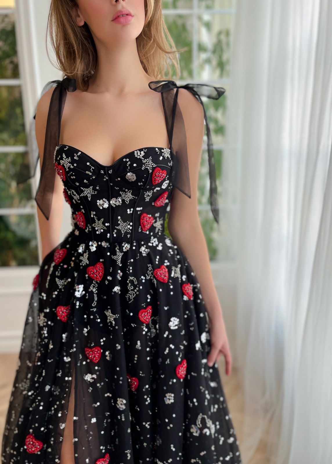 Black A-Line dress with bow straps and printed fabric