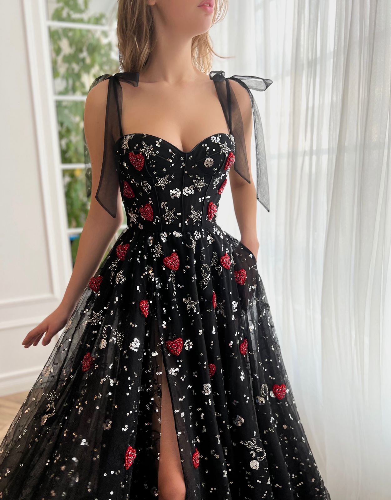 Black A-Line dress with bow straps and printed fabric