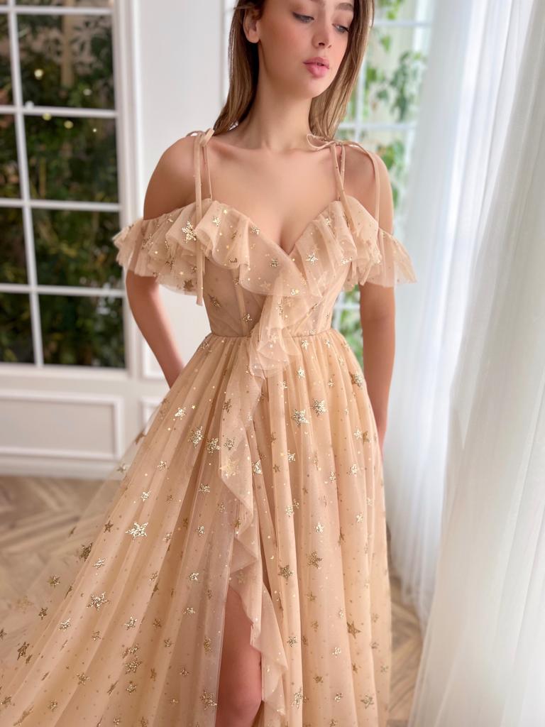 Beige A-Line dress with spaghetti straps, starry fabric and off the shoulder sleeves
