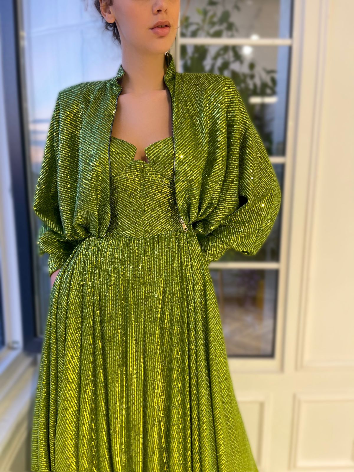 Green two piece dress with long sleeves and sequins