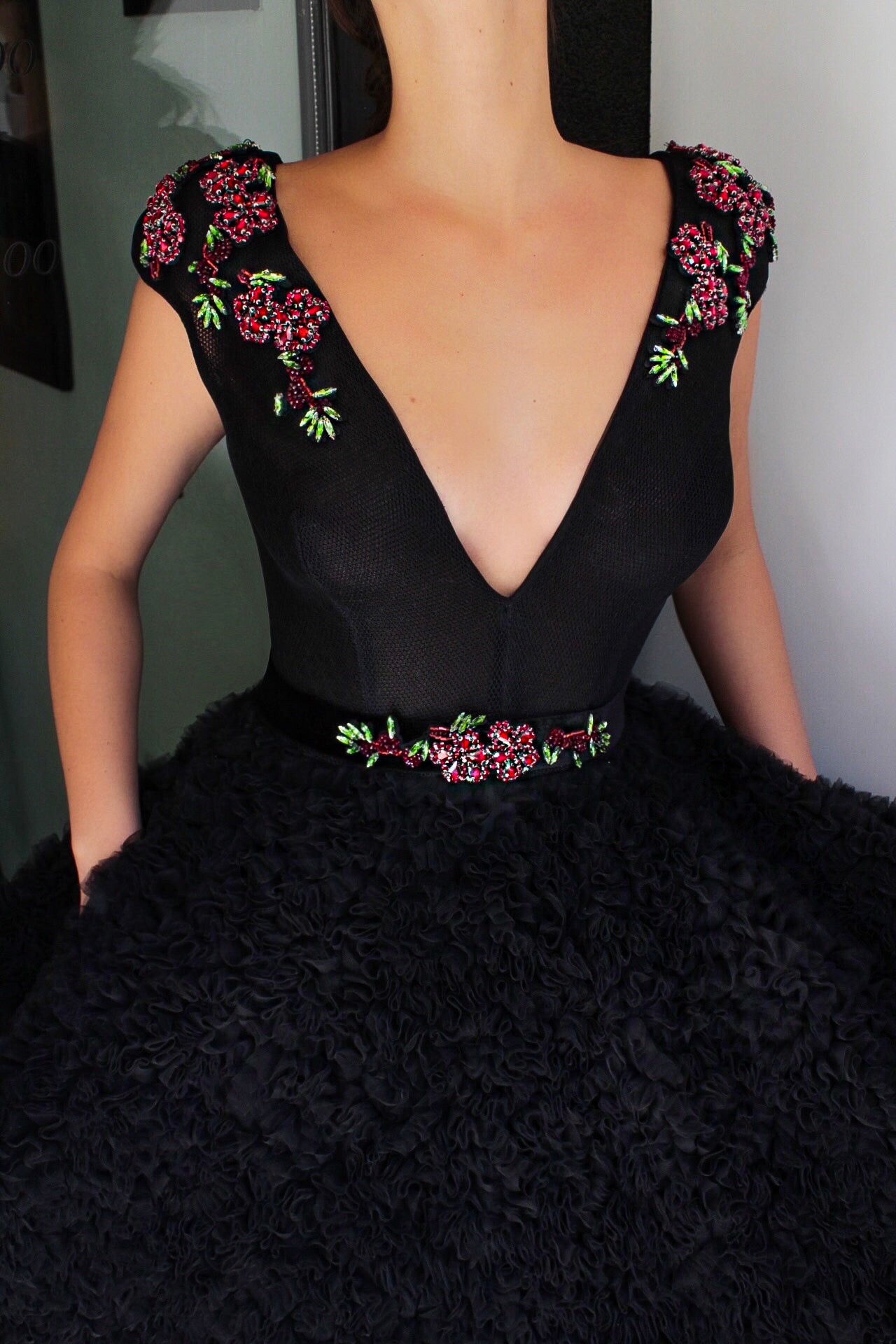Black A-Line dress with v-neck, no sleeves and embroidery