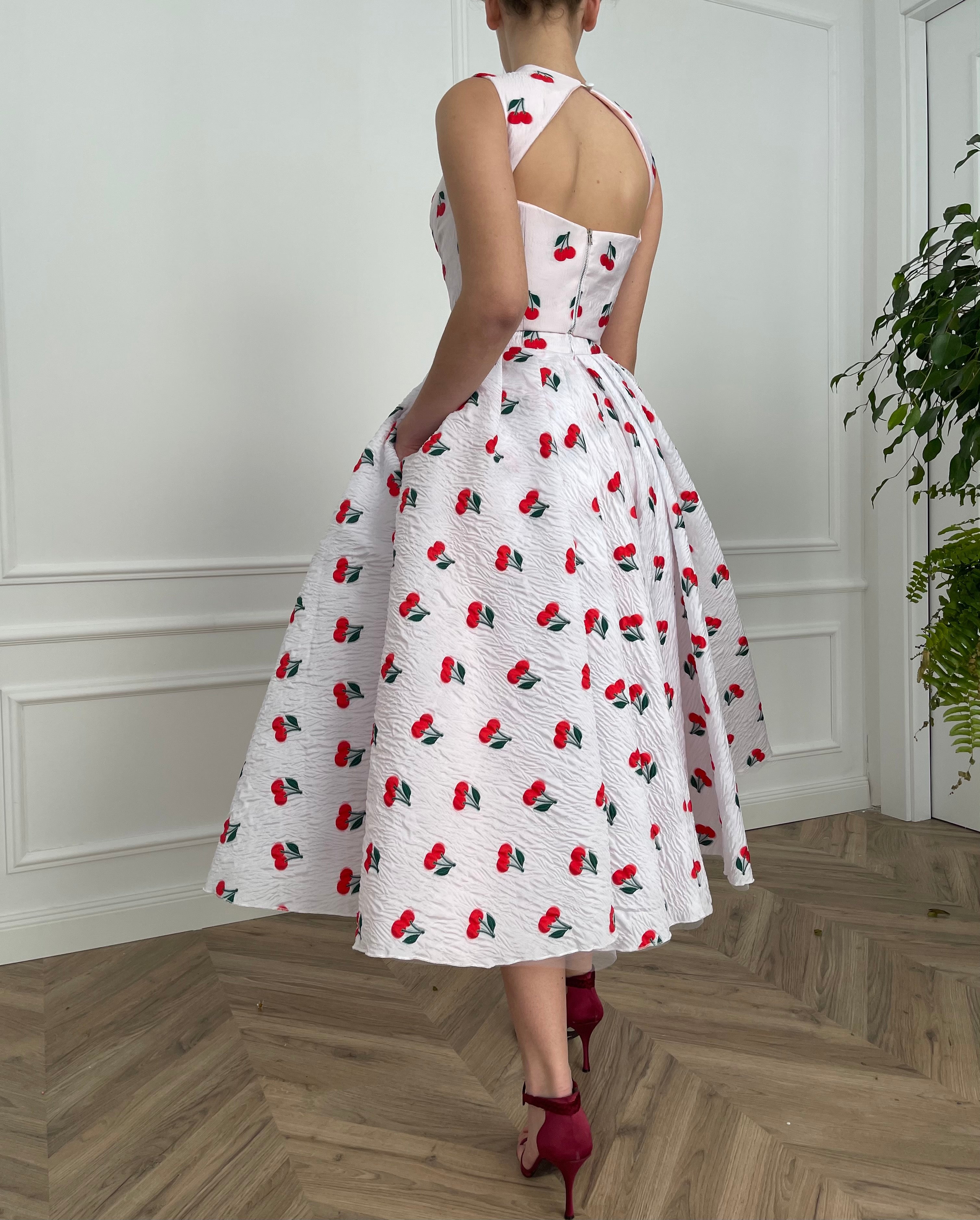 White two piece dress with printed cherries and straps