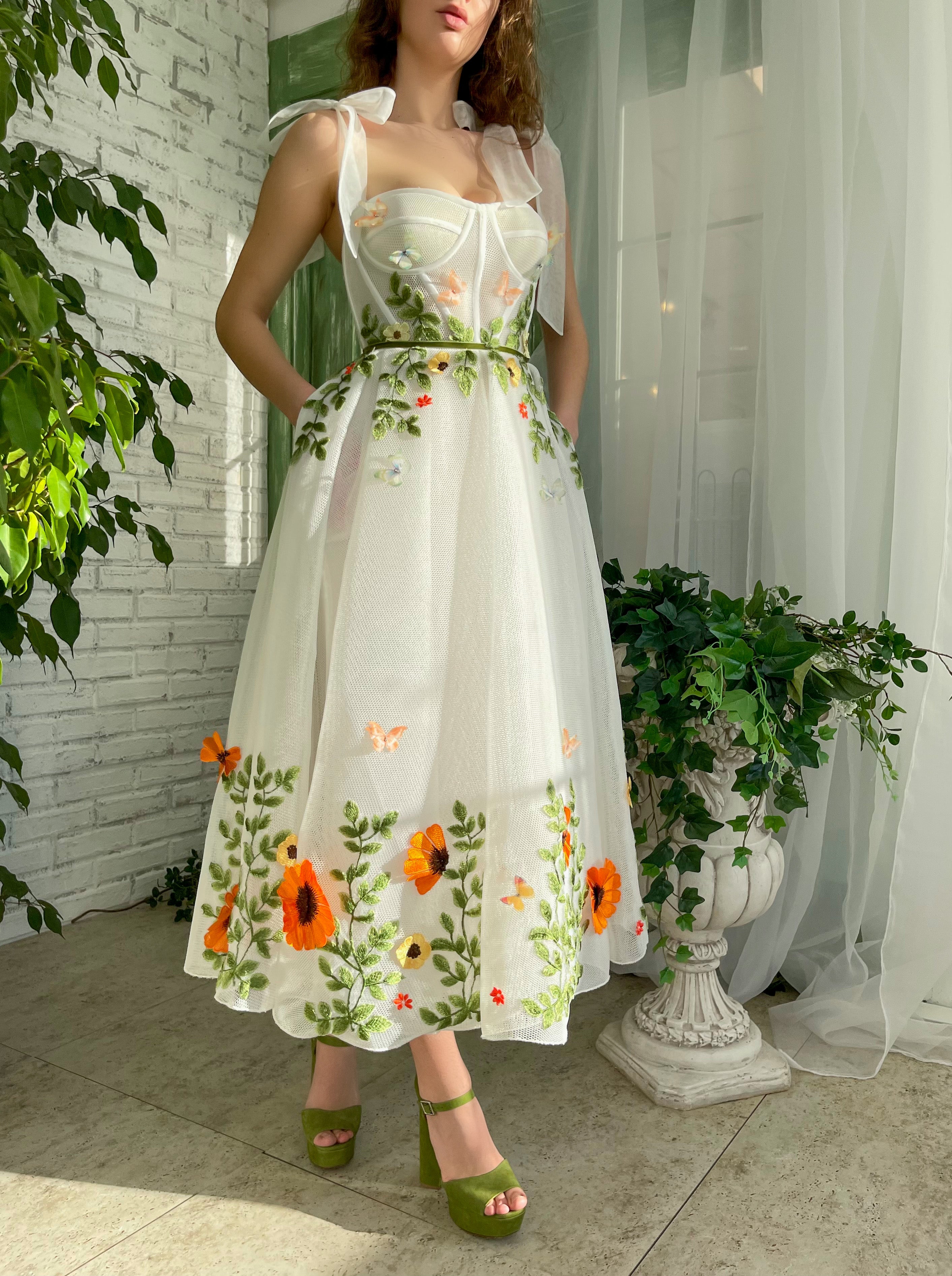 White midi dress with bow straps and embroidery