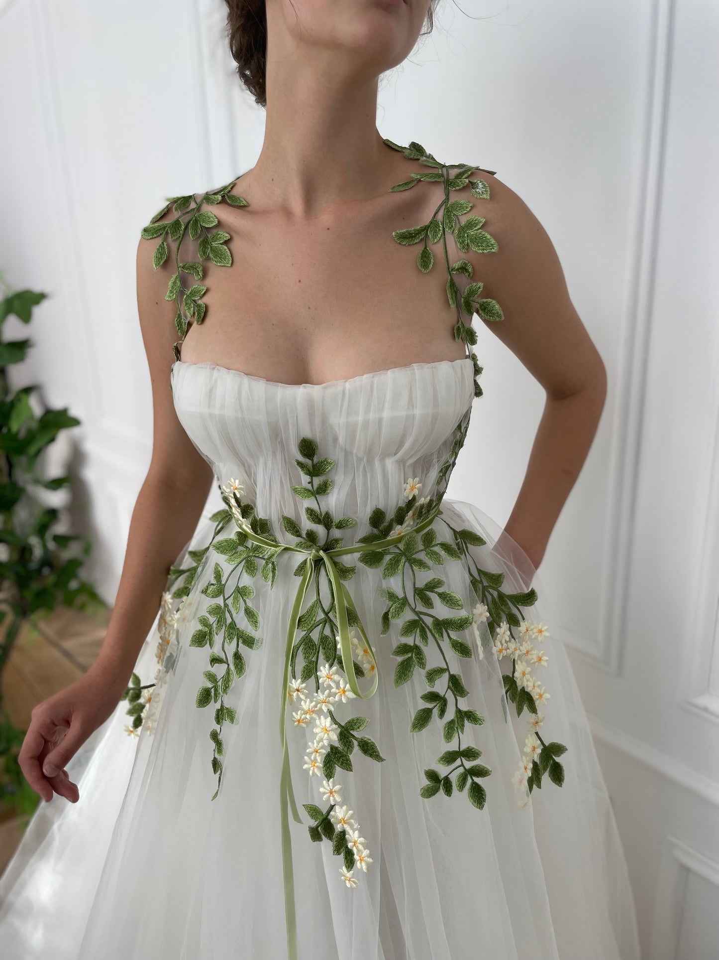 A line white bridal dress with straps and embroidered flowers