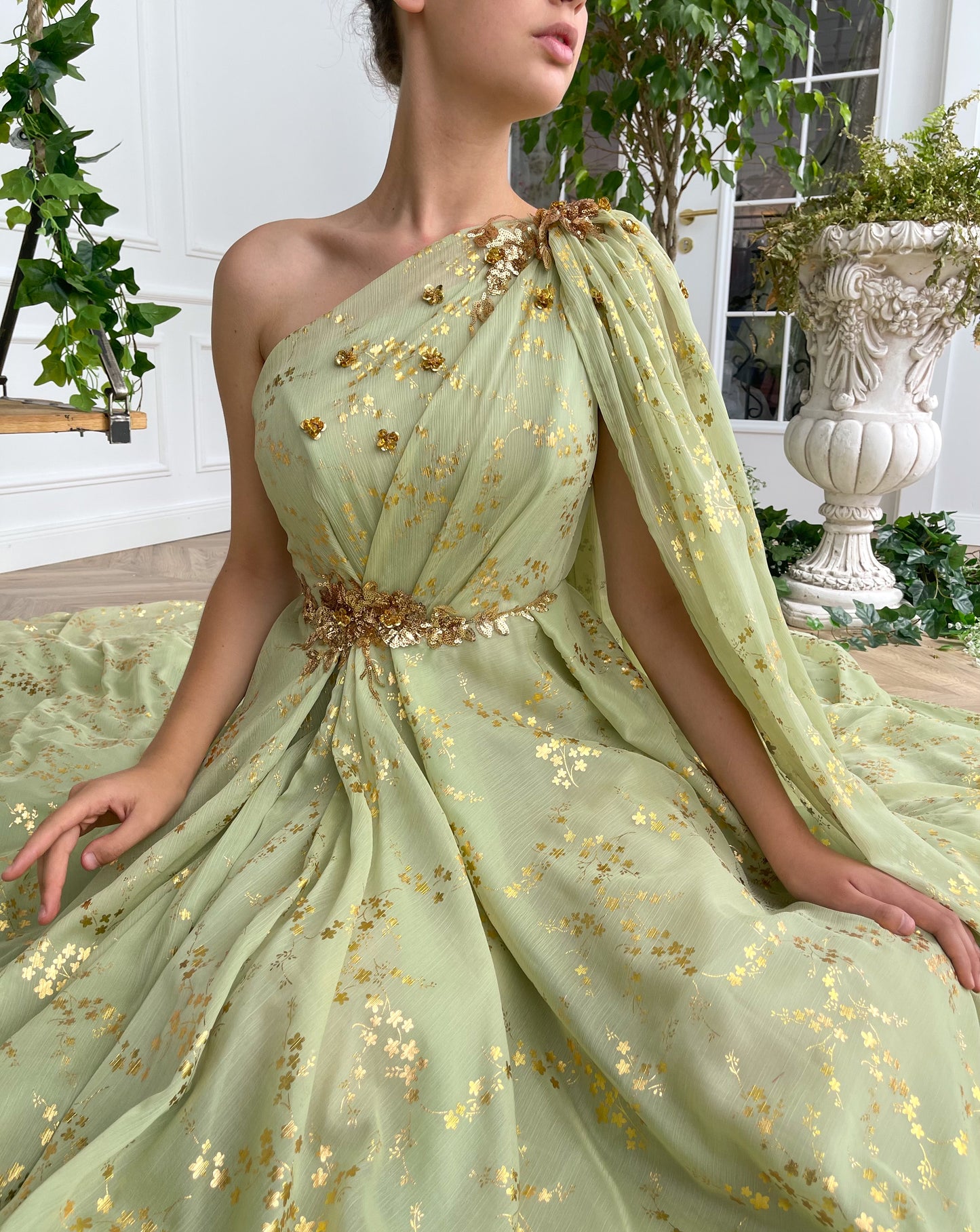 Green A-Line dress with embroidery, one shoulder sleeve and cape sleeve
