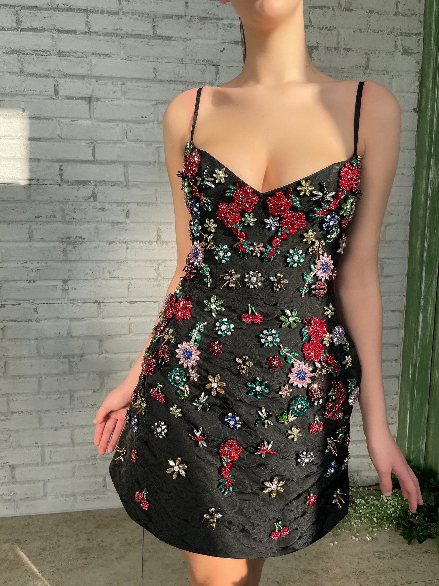 Black mini dress with spaghetti straps and embroidery