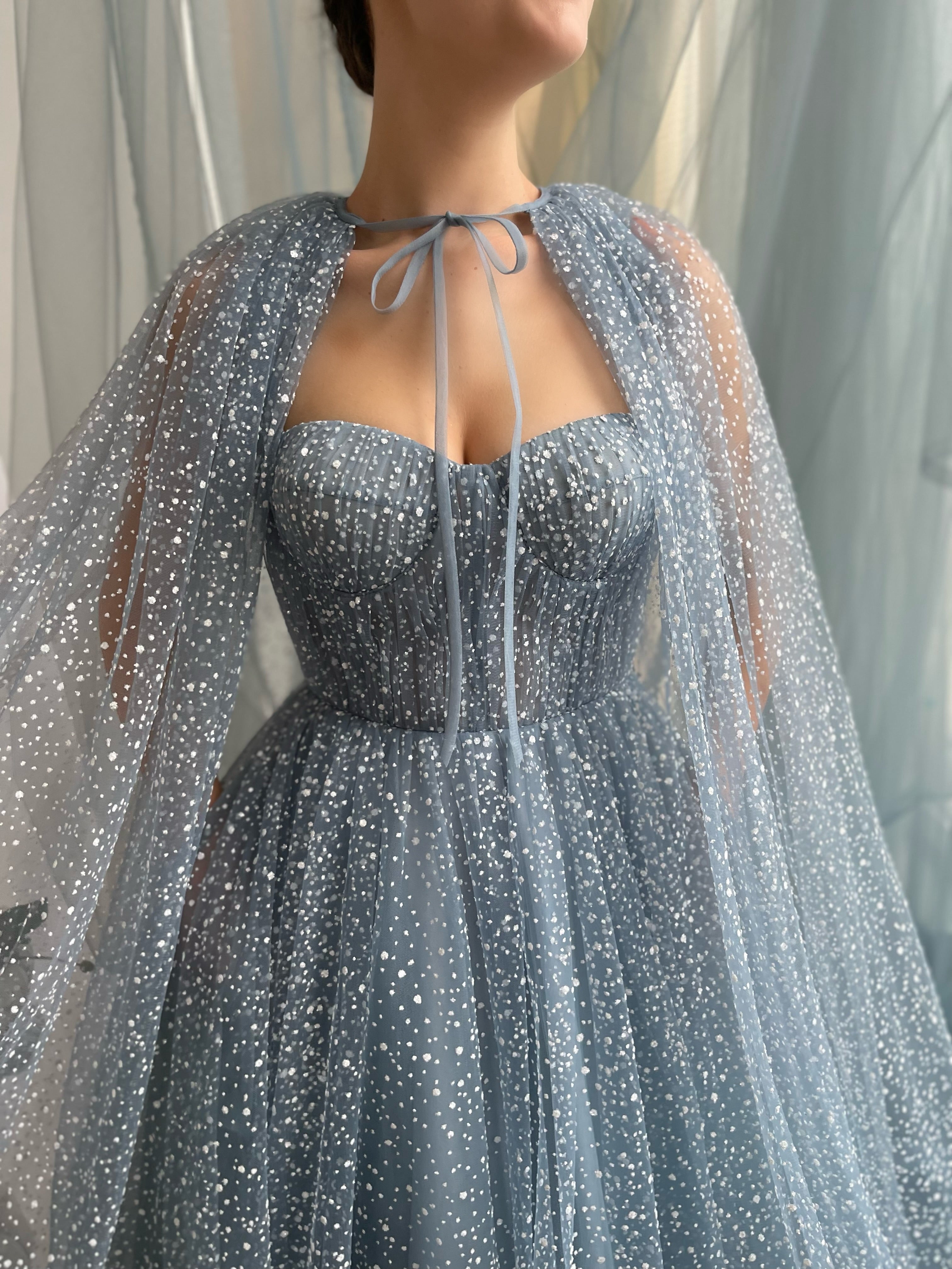 Blue A-Line dress with no sleeves and cape
