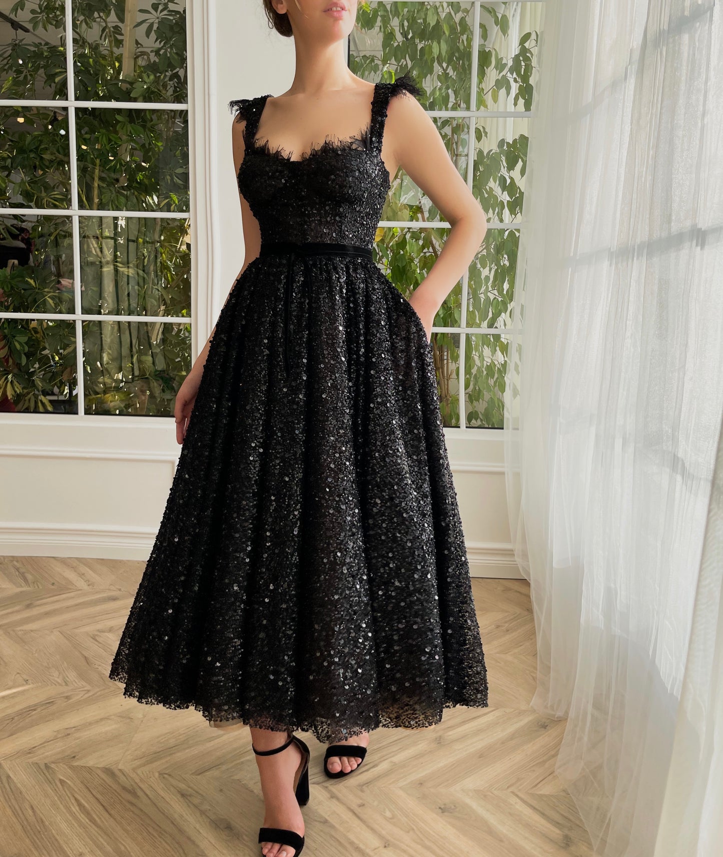 Black midi dress with sequins and straps