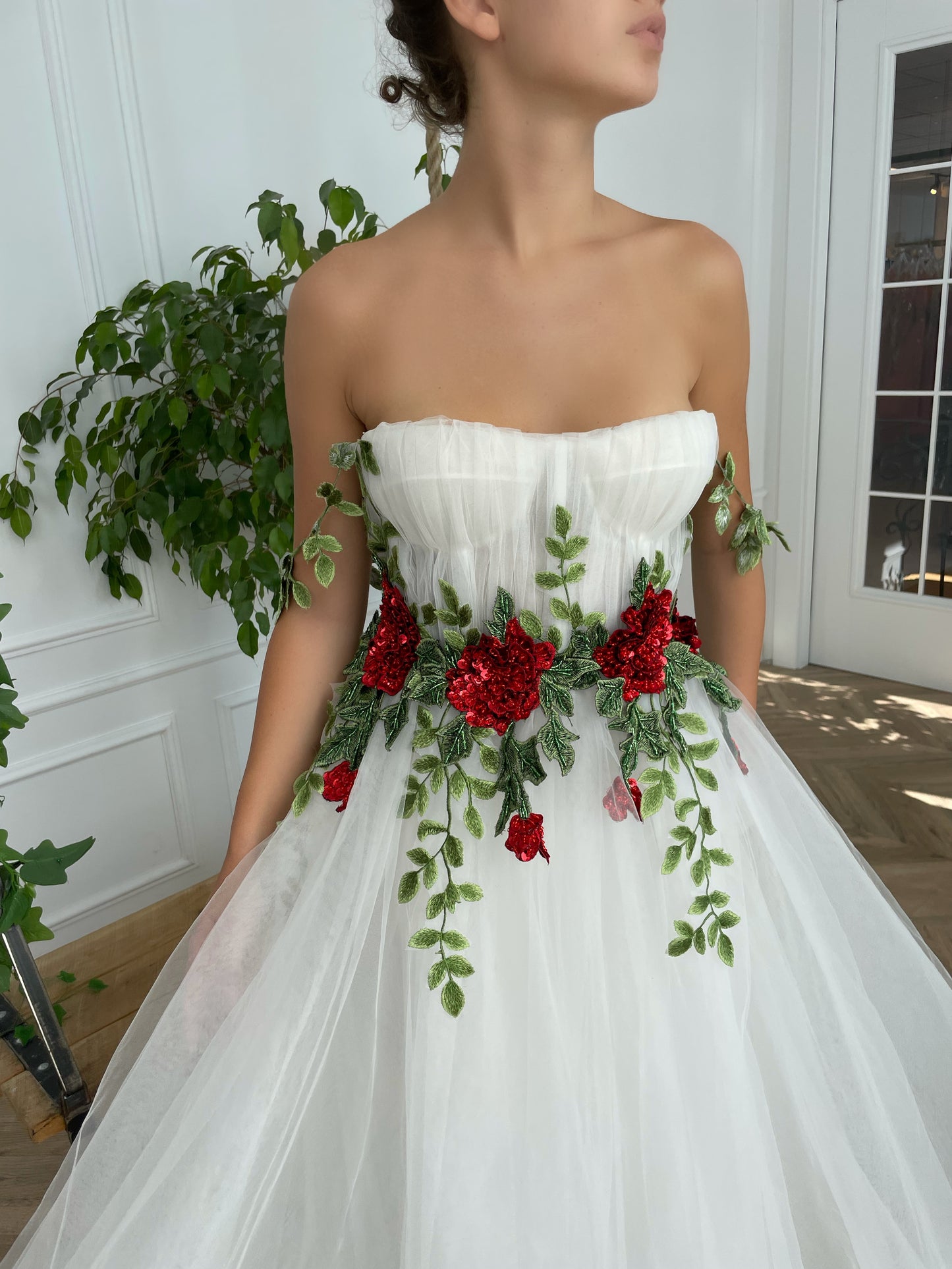 A line white bridal dress with straps and embroidered flowers
