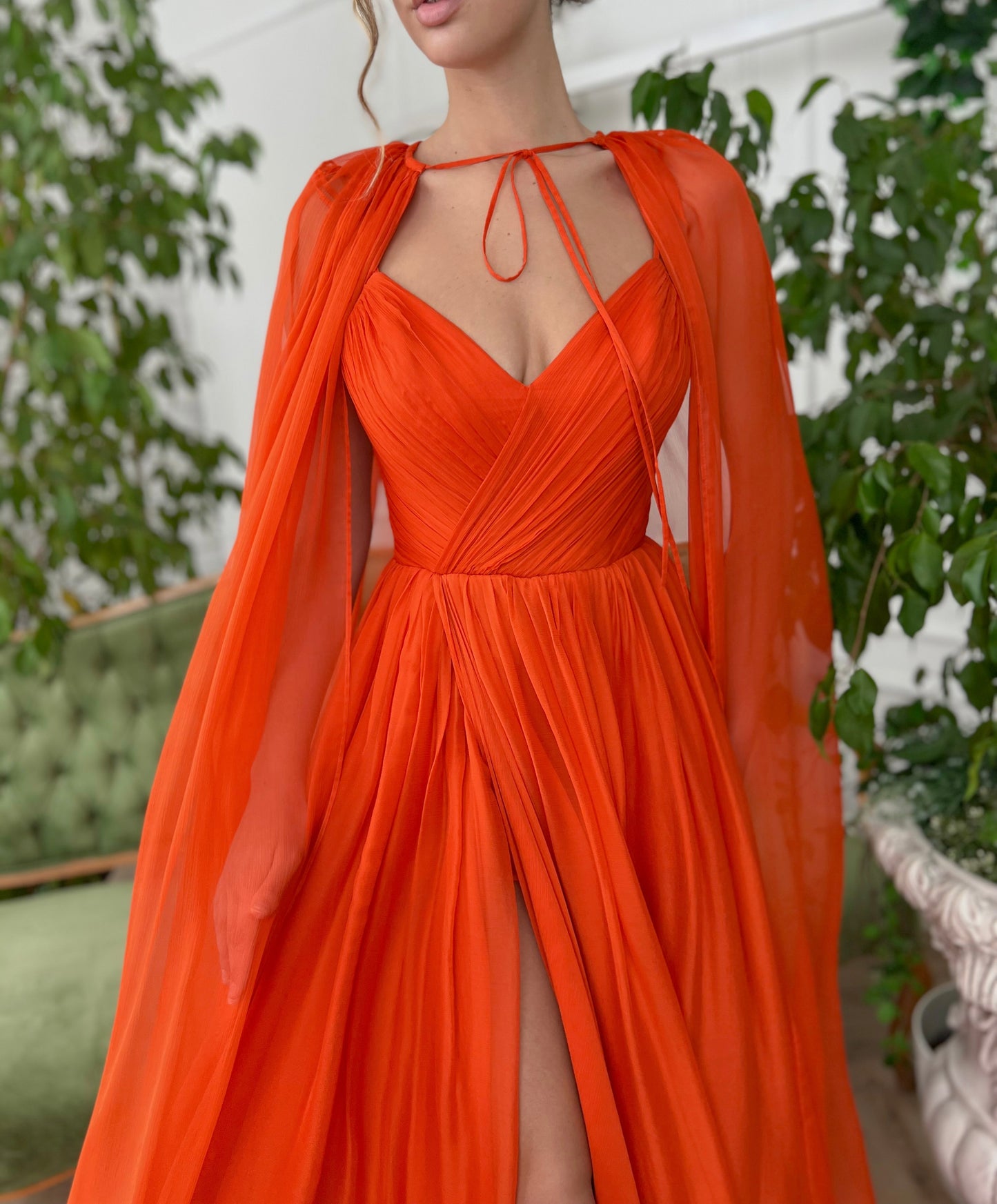 Orange A-Line dress with v-neck, no sleeves and cape