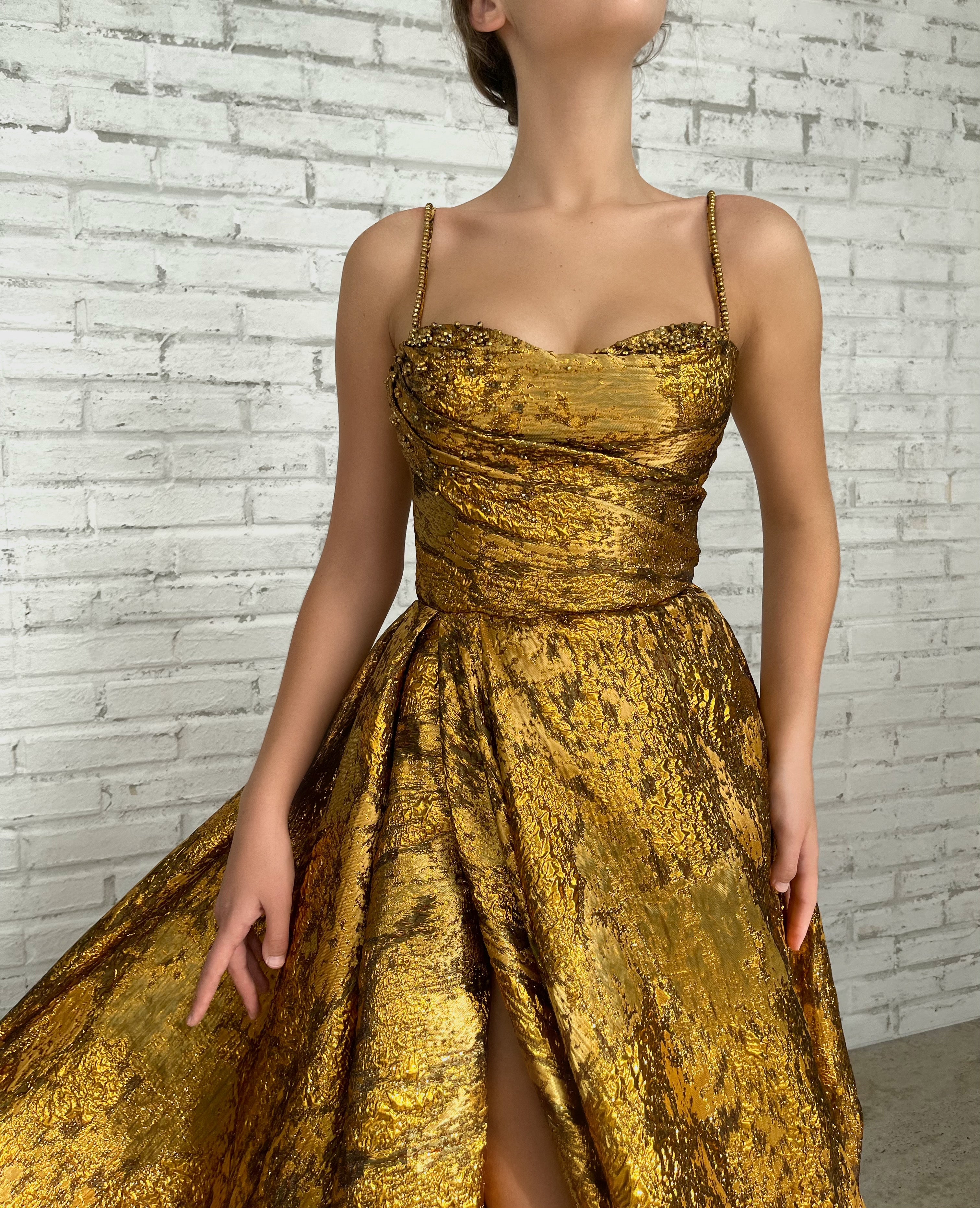 Gold A-Line dress with spaghetti straps and beading