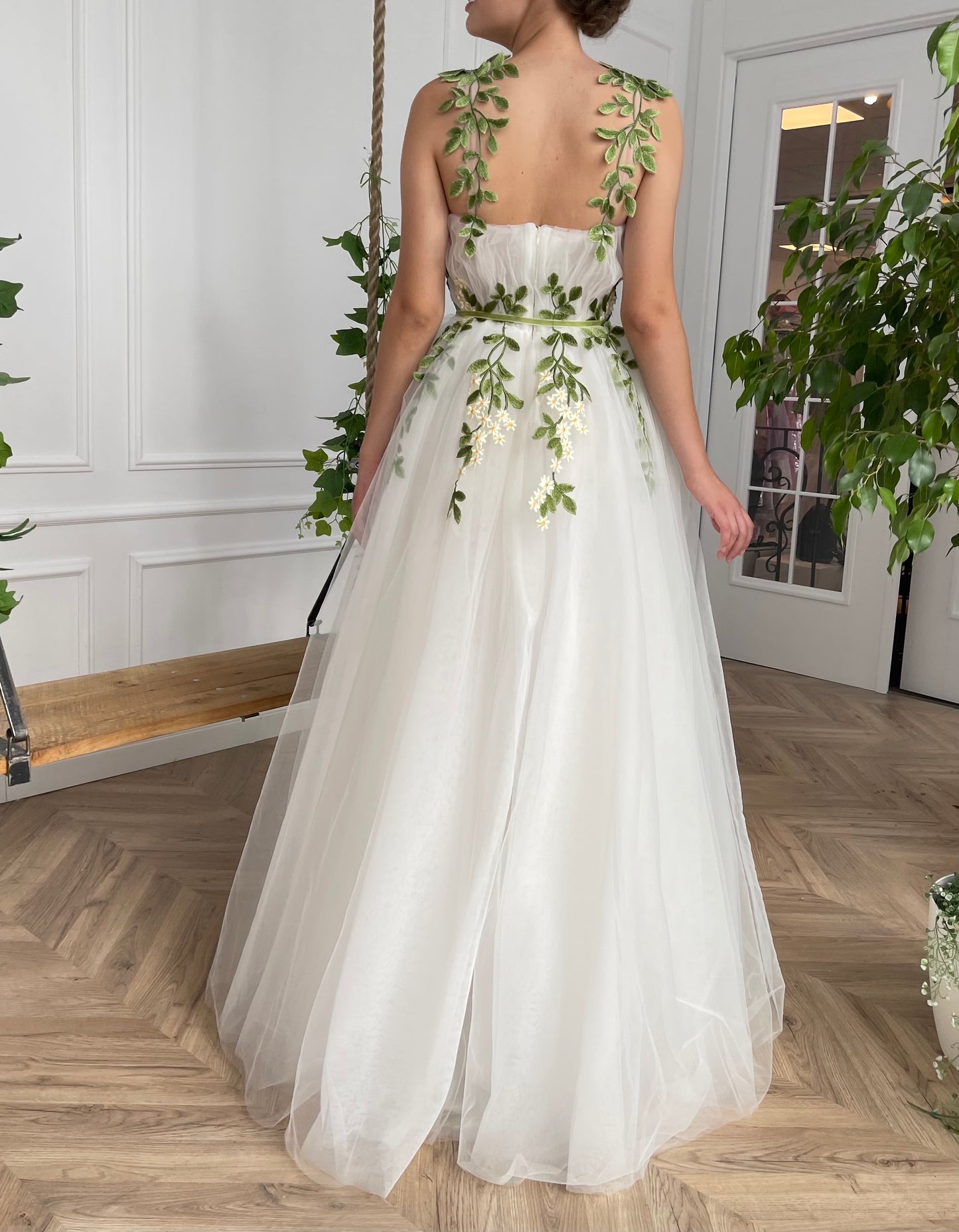 A line white bridal dress with straps and embroidered flowers