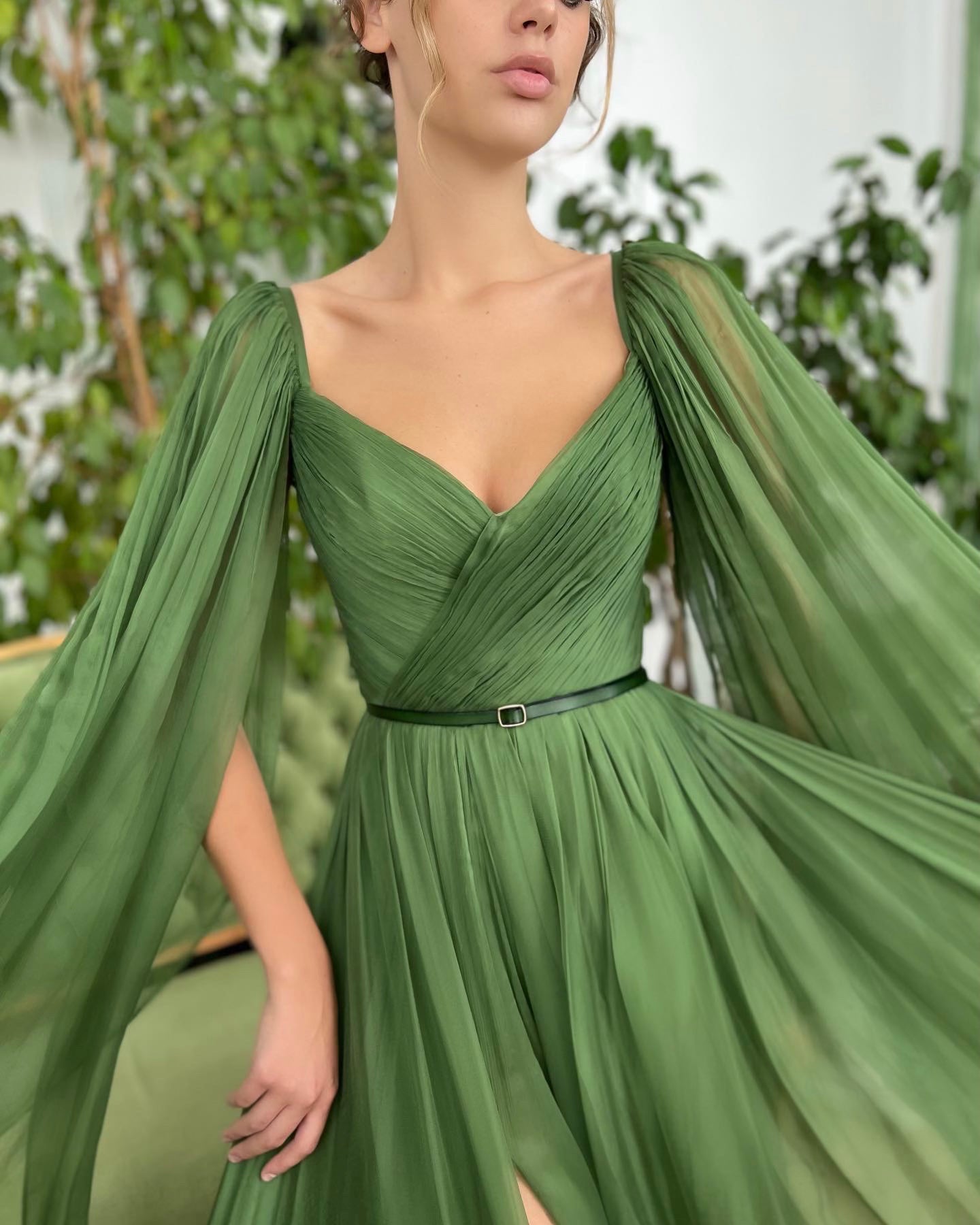 Green A-Line dress with v-neck, belt and cape sleeves 