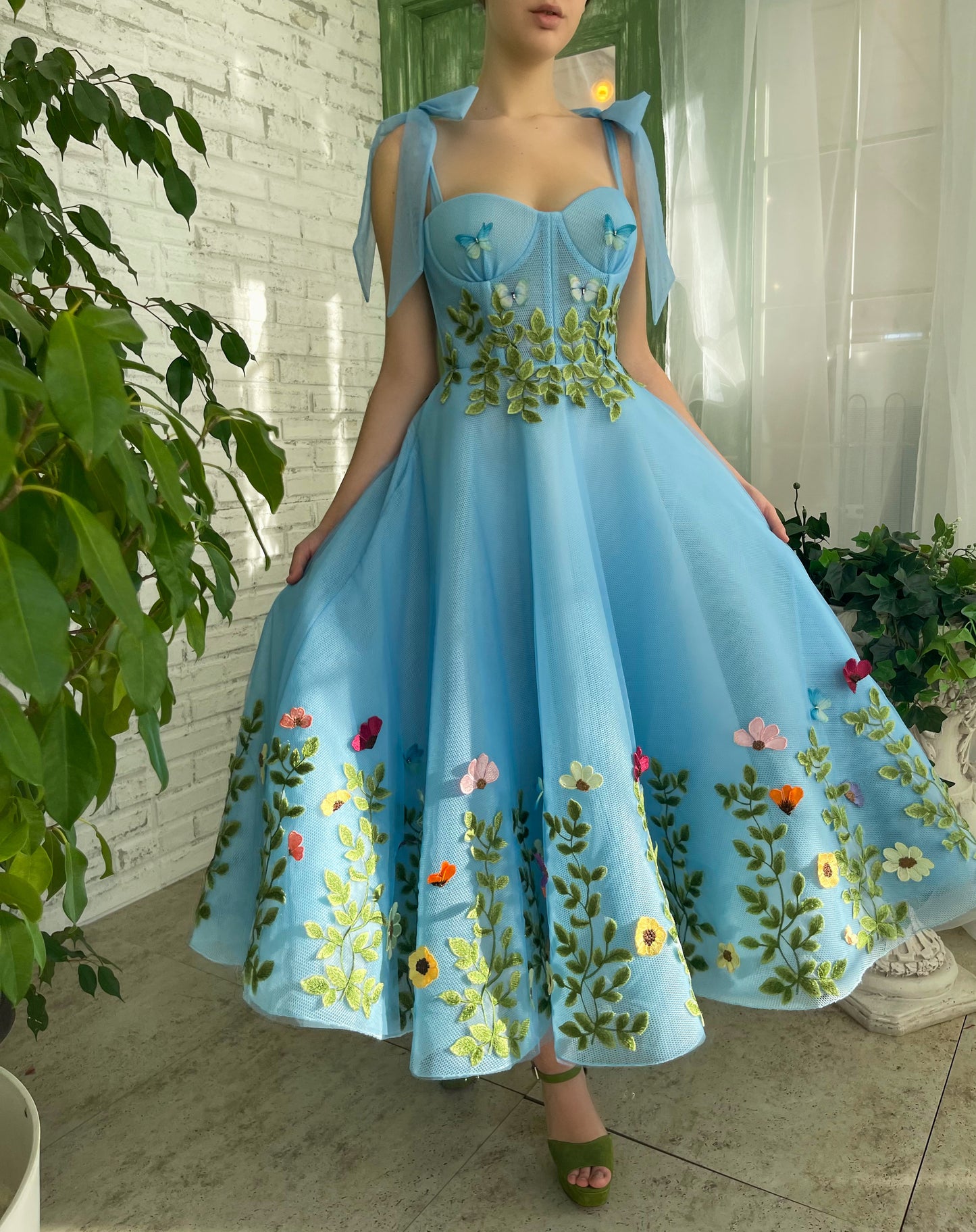 Blue midi dress with bow straps and embroidery