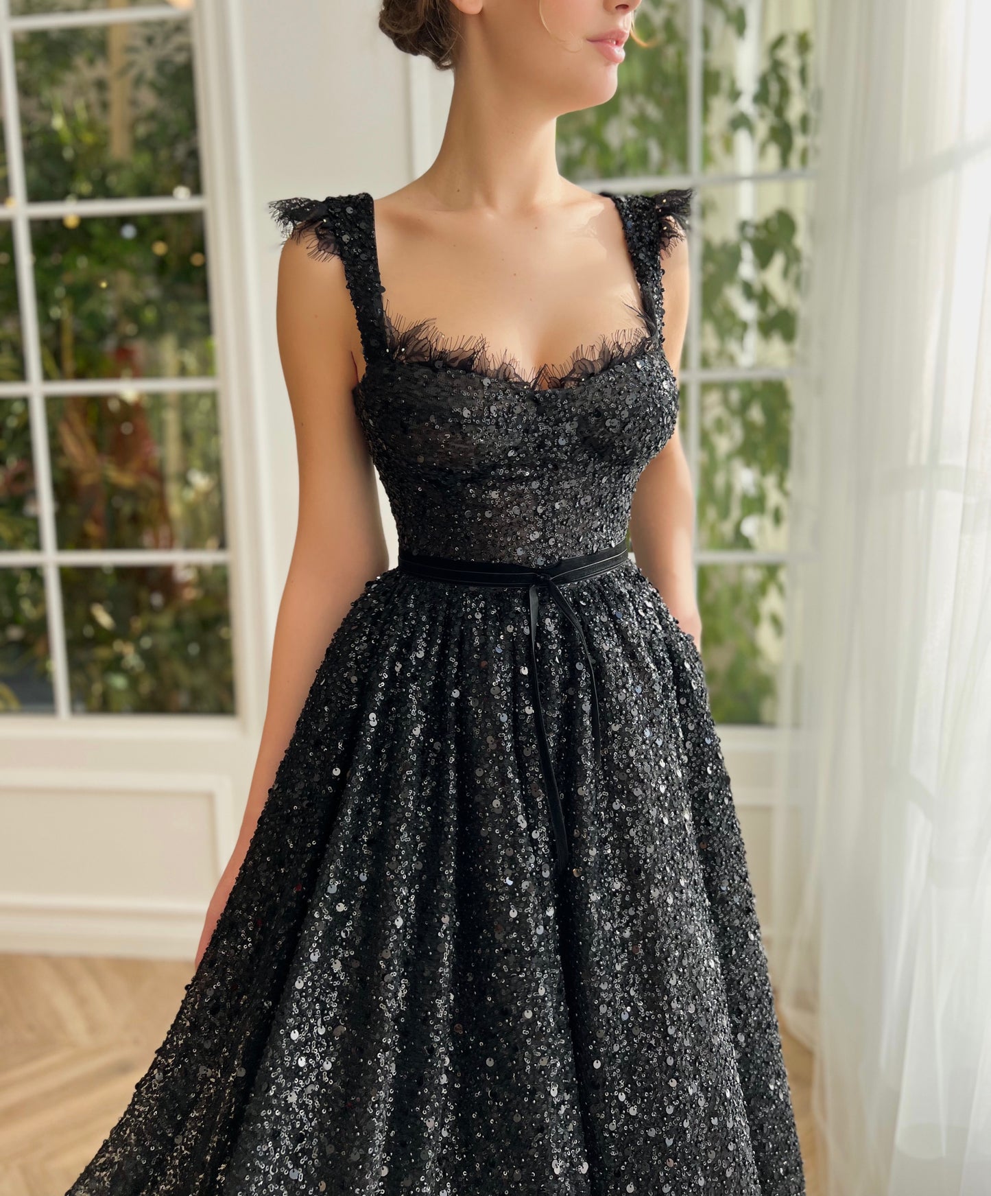 Black midi dress with sequins and straps