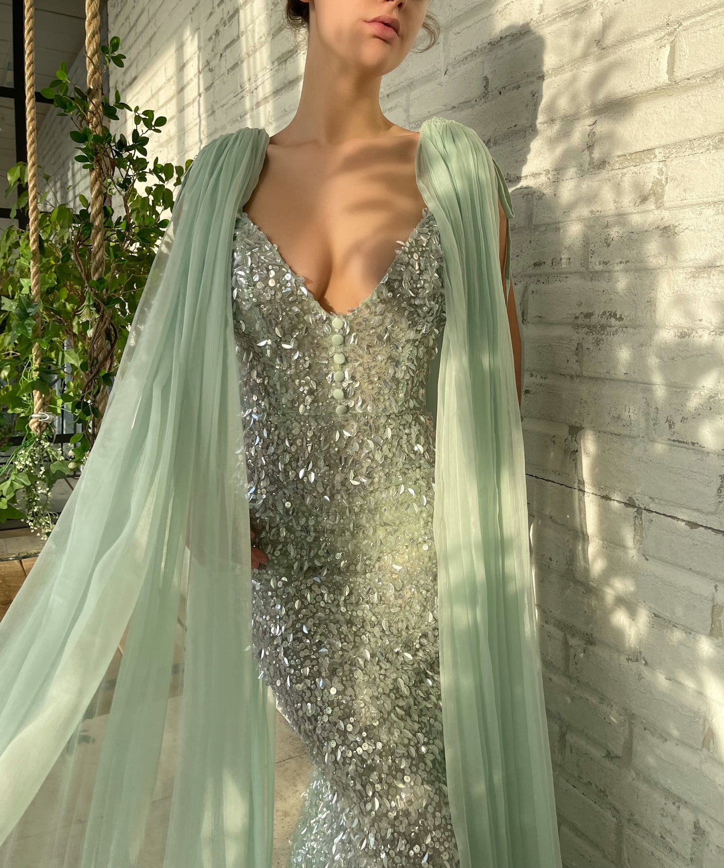 Green mermaid dress with cape sleeves and v-neck