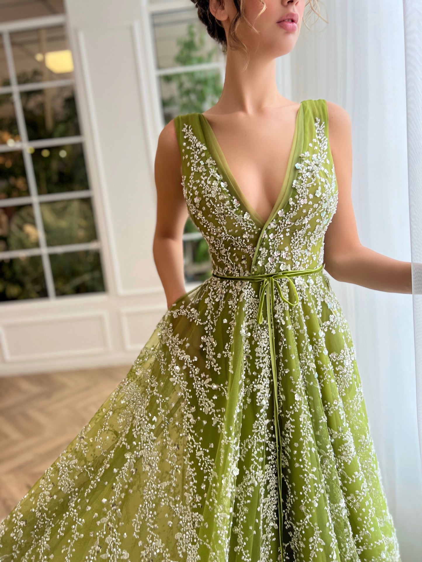 Green A-Line dress with no sleeves and v-neck
