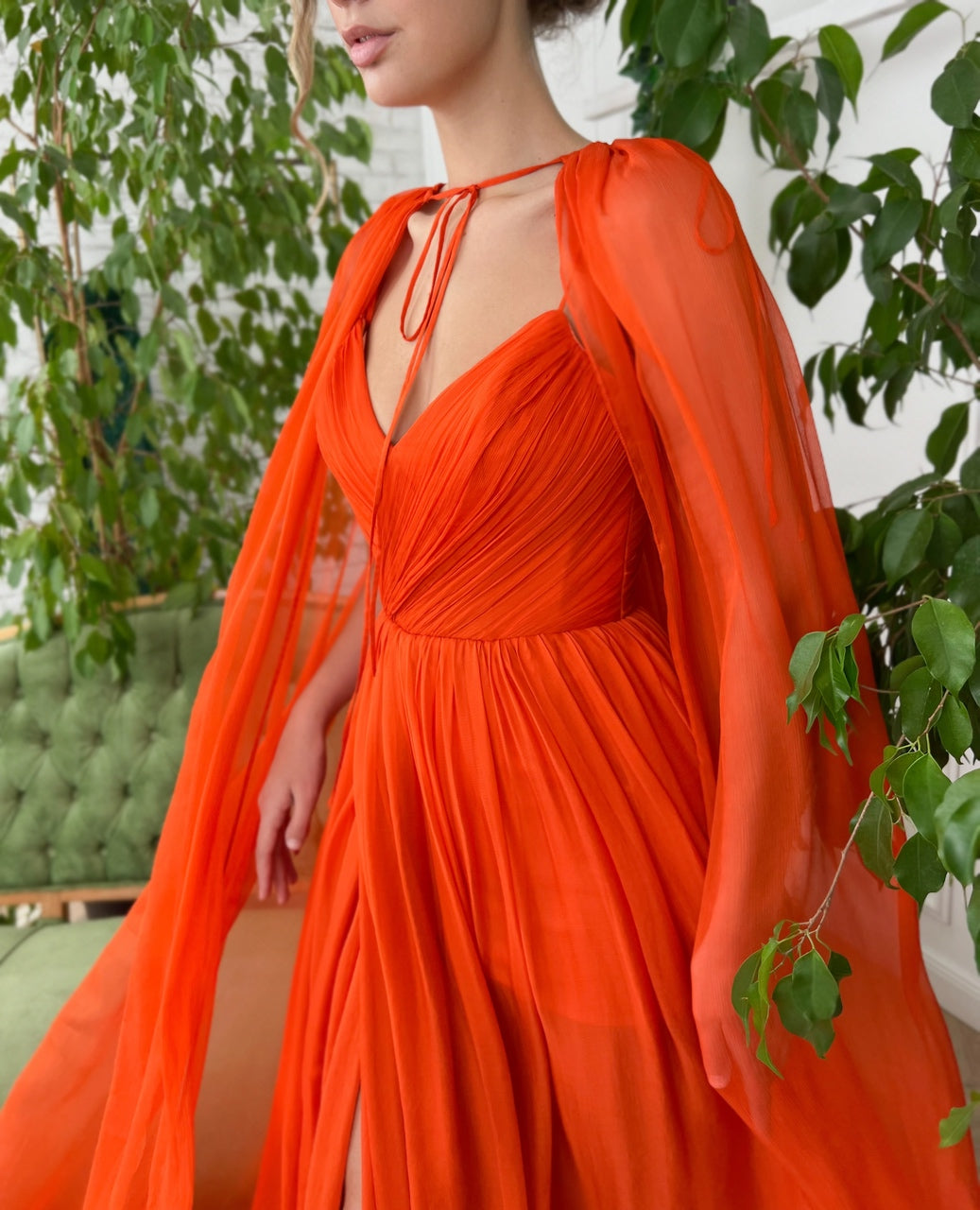 Orange A-Line dress with v-neck, no sleeves and cape