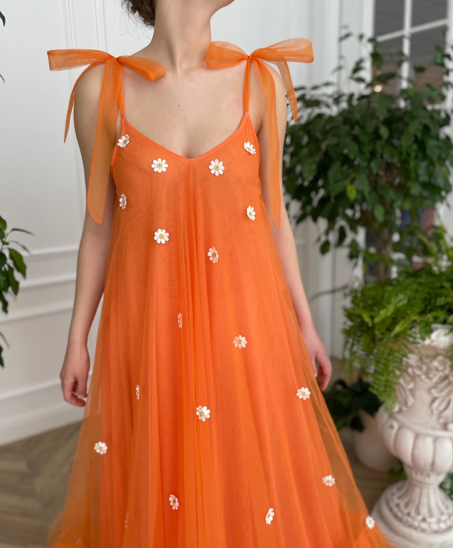 Orange sheath dress with embroidered daisies and bow straps