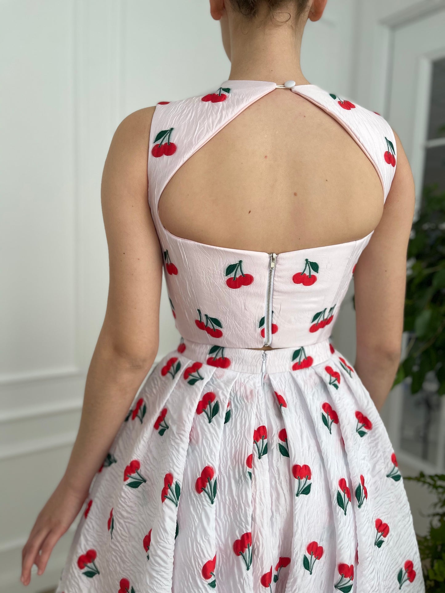 White two piece dress with printed cherries and straps