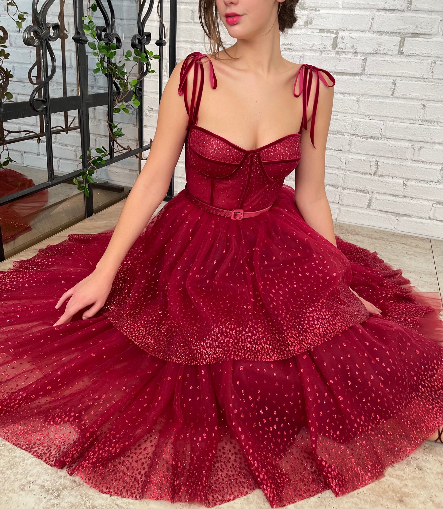 Red midi dress with spaghetti straps and belt