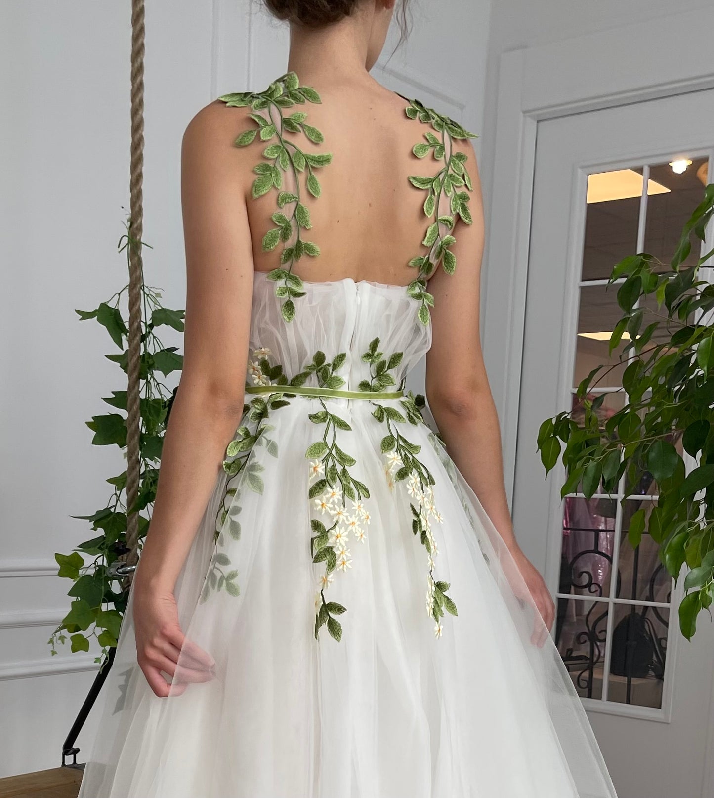 A line white bridal dress with straps and embroidered flowers