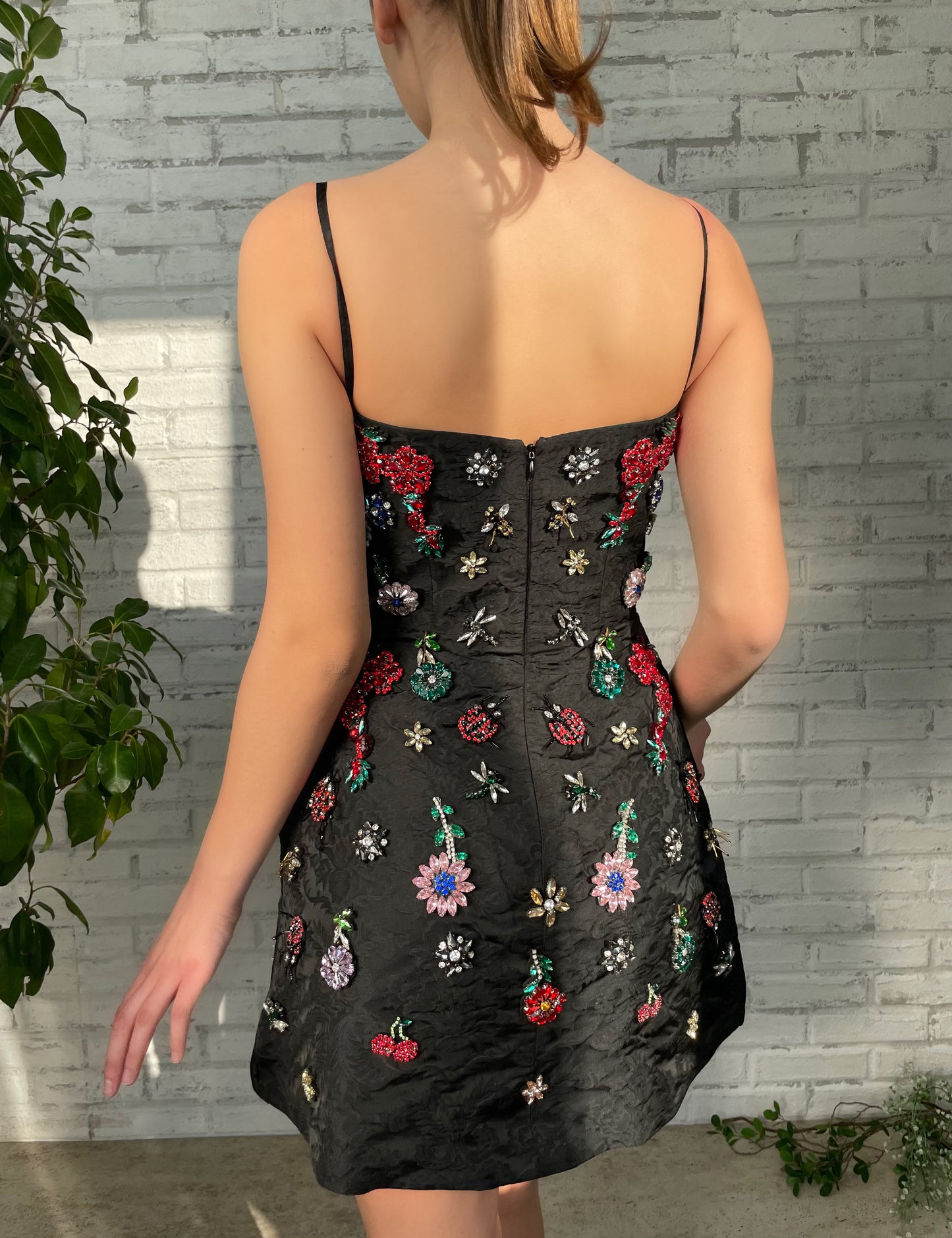 Black mini dress with spaghetti straps and embroidery