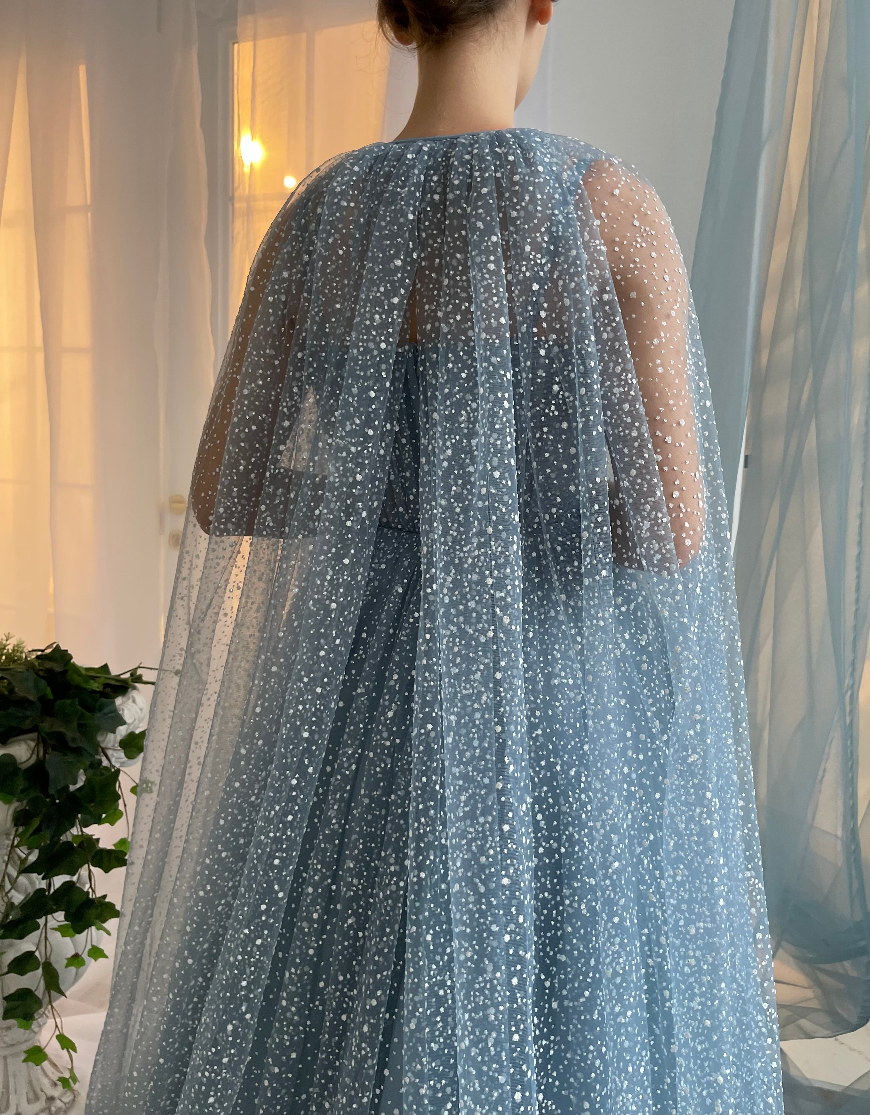 Blue A-Line dress with no sleeves and cape