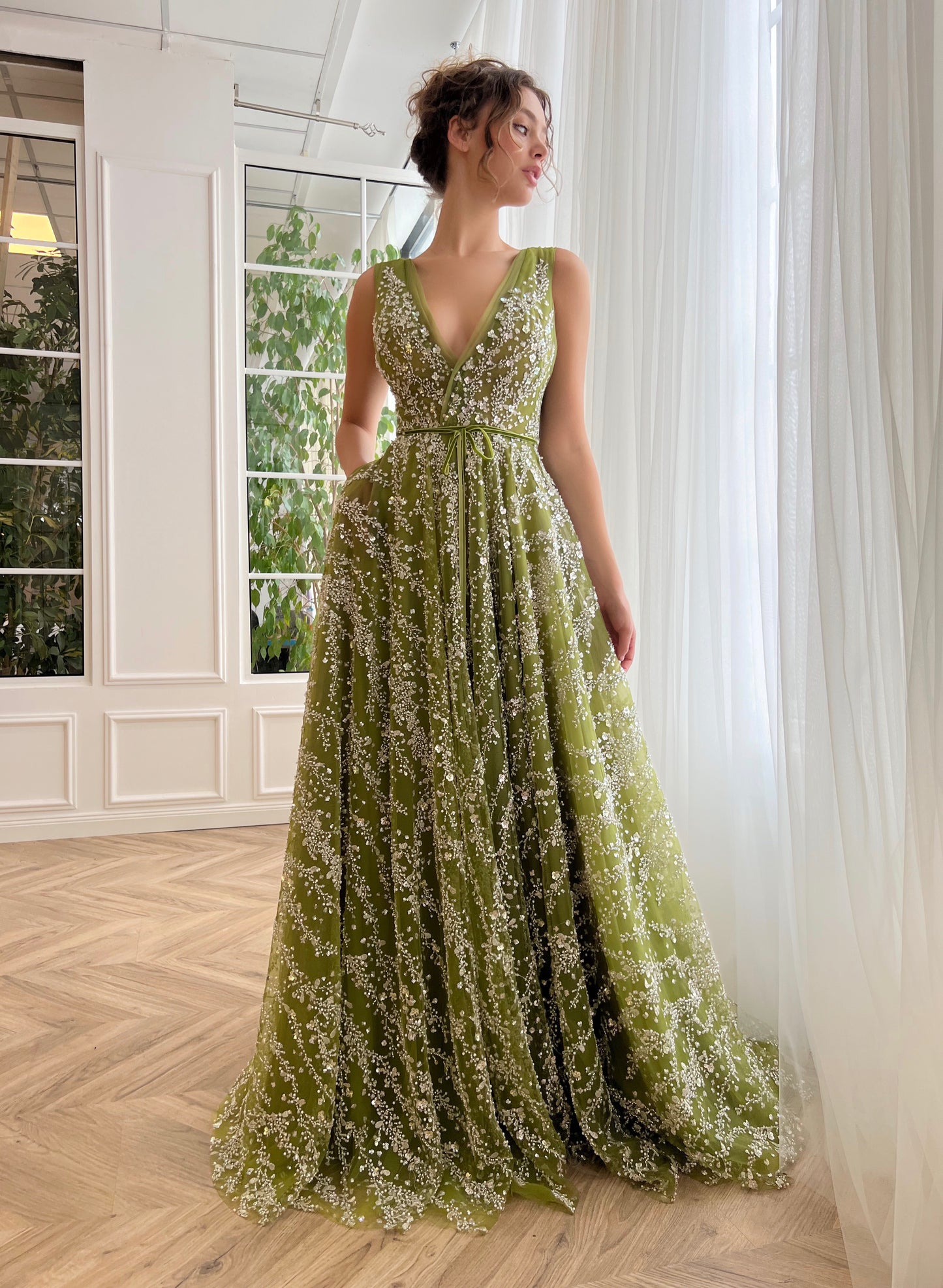 Green A-Line dress with no sleeves and v-neck