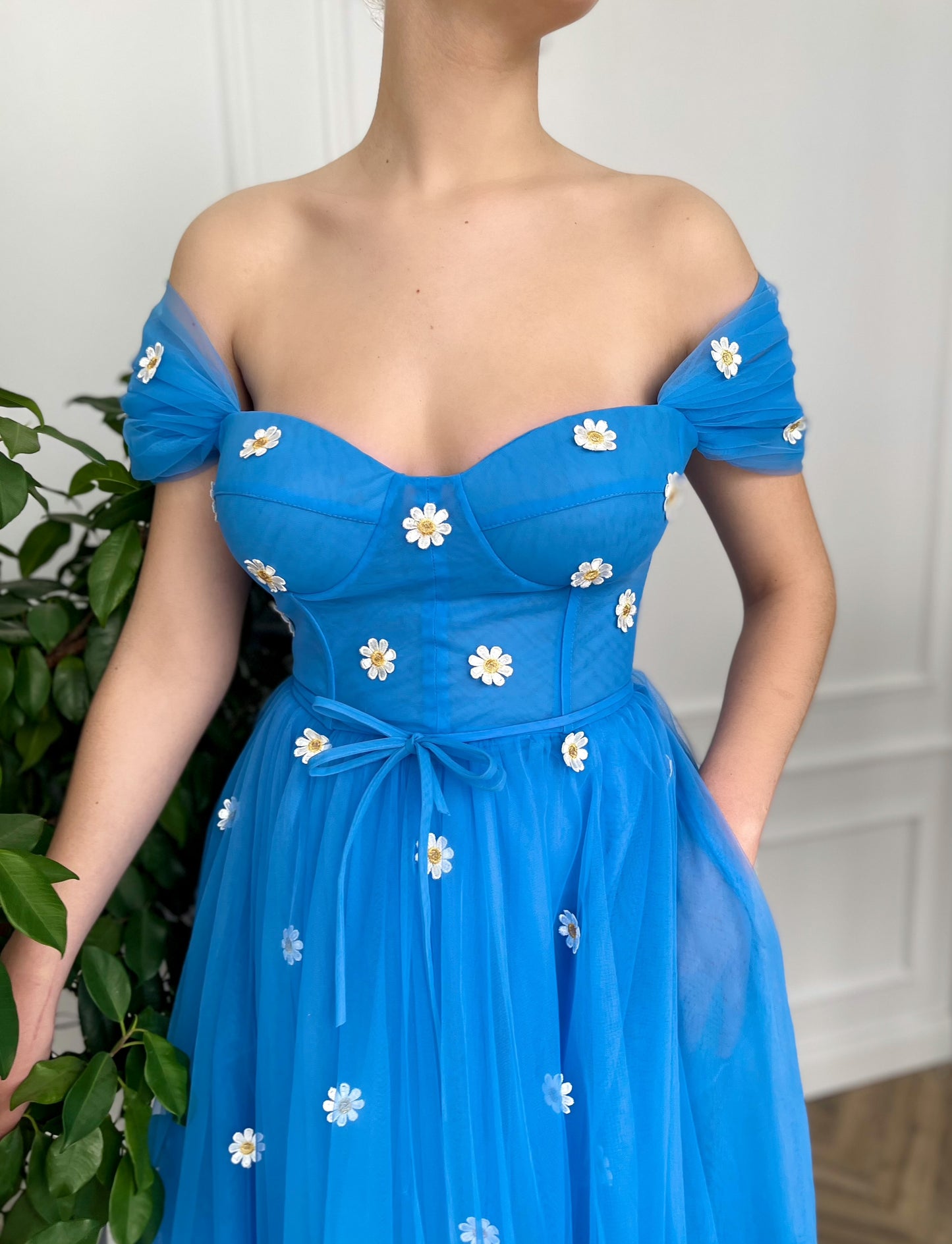 Blue midi dress with off the shoulder sleeves and embroidered daisies