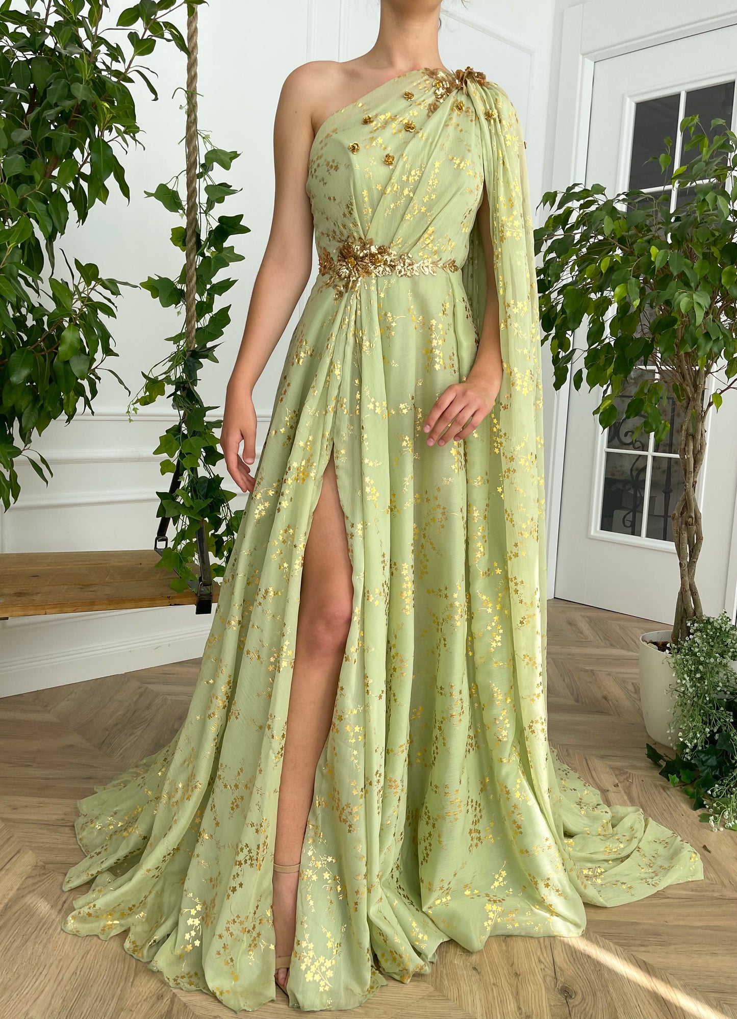 Green A-Line dress with embroidery, one shoulder sleeve and cape sleeve