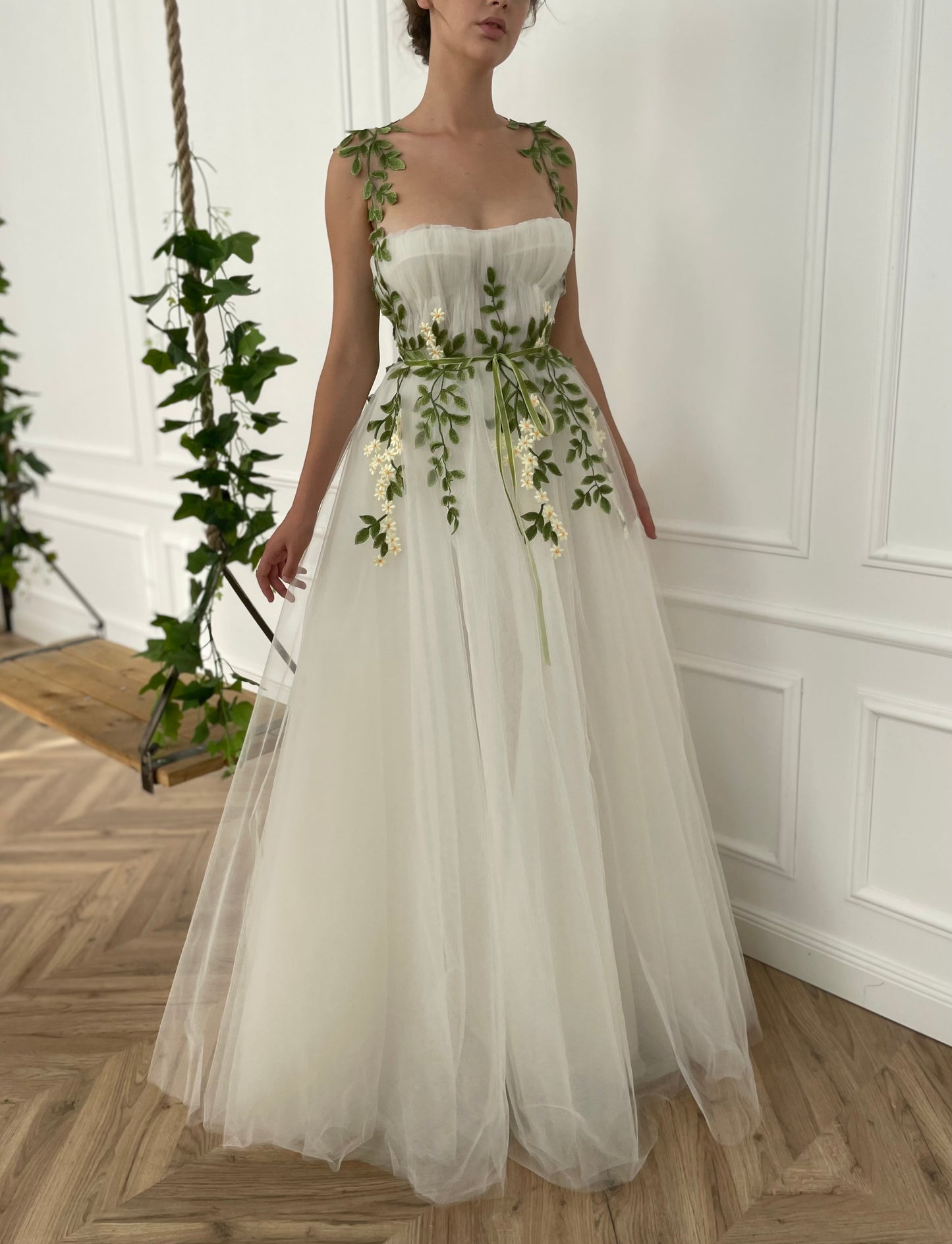 A line white bridal dress with straps and embroidered flowers